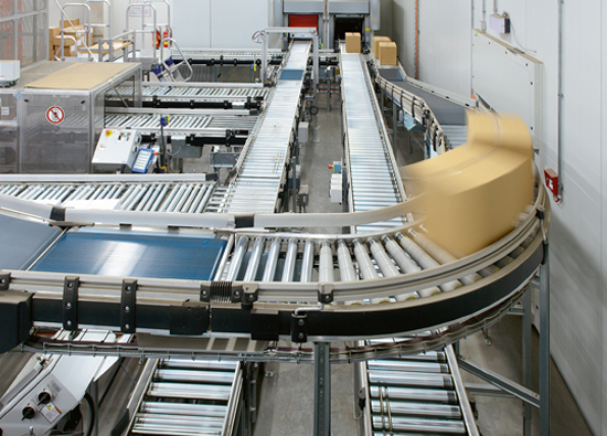 Close-up of automatic small parts storage and the conveyor connection to the picking zone